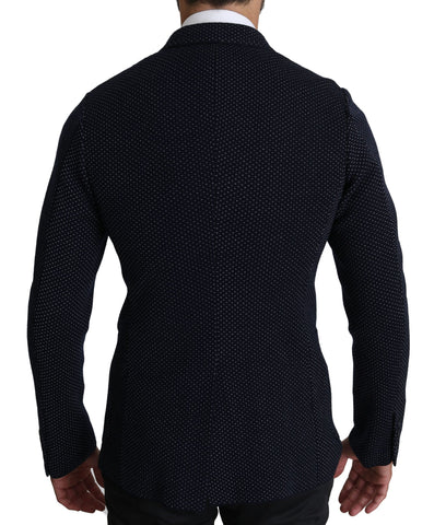 Dark blue dotted double-breasted coat blazer by Dolce & Gabbana with tailored fit and classic lapels, displayed on a hanger.