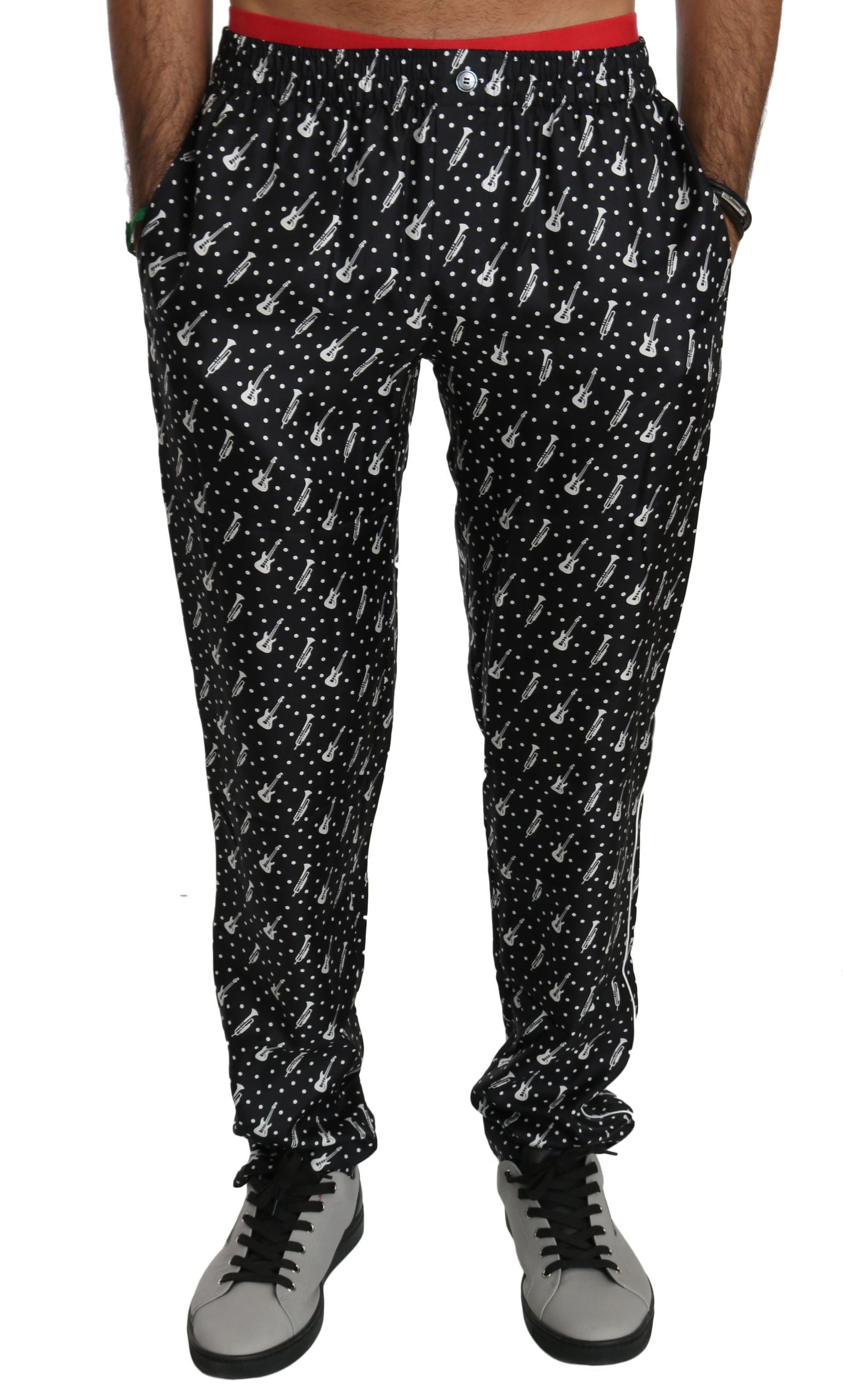 Silk black musical instrument trouser pants by Dolce & Gabbana displayed on a model, featuring a sleek, tailored fit and smooth fabric.