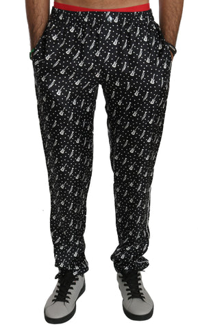 Silk black musical instrument trouser pants by Dolce & Gabbana displayed on a model, featuring a sleek, tailored fit and smooth fabric.
