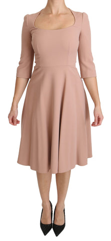 Pink Dolce & Gabbana 3/4 sleeve A-line viscose dress displayed on a mannequin with a V-neck and floral pattern.