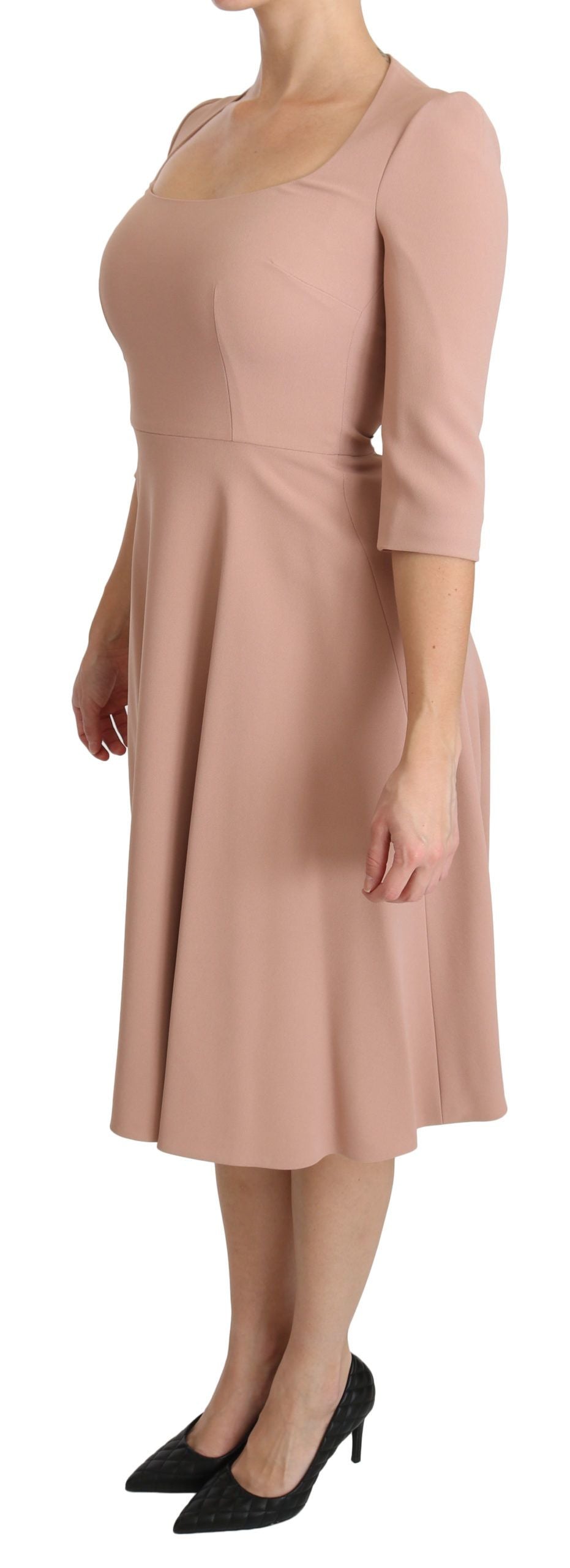 Pink Dolce & Gabbana 3/4 sleeve A-line viscose dress displayed on a hanger with a V-neck design.