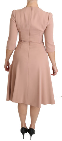Pink Dolce & Gabbana 3/4 sleeve A-line viscose dress displayed on a hanger with a V-neck design.
