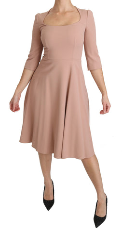 Pink Dolce & Gabbana 3/4 sleeve A-line viscose dress with V-neck, flowing silhouette, and stylish design.