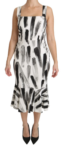 White and black printed sheath midi dress by Dolce & Gabbana, made of flowing viscose fabric with a fitted silhouette.
