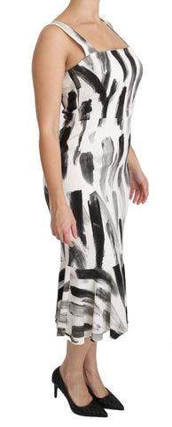 White and black printed sheath midi dress made of viscose by Dolce & Gabbana, shown with a fitted silhouette and stylish pattern.