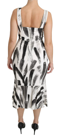 White and black printed sheath midi dress made of viscose by Dolce & Gabbana, featuring a sleek V-neck and fitted silhouette.