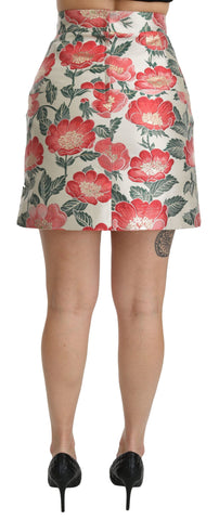 White, green, and red floral high-waist mini skirt by Dolce & Gabbana, featuring a vibrant floral print and a fitted high waist.