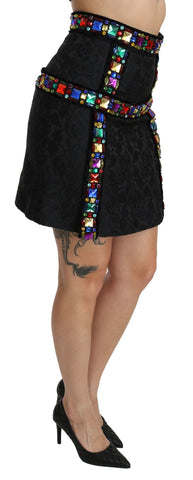 Black high waist skirt by Dolce & Gabbana with crystal embellishments, showcasing a sleek, elegant design and luxurious detailing.