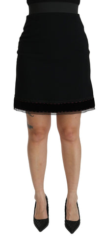 Black A-line high waist mini skirt made of viscose by Dolce & Gabbana, showcasing a stylish and fitted silhouette.