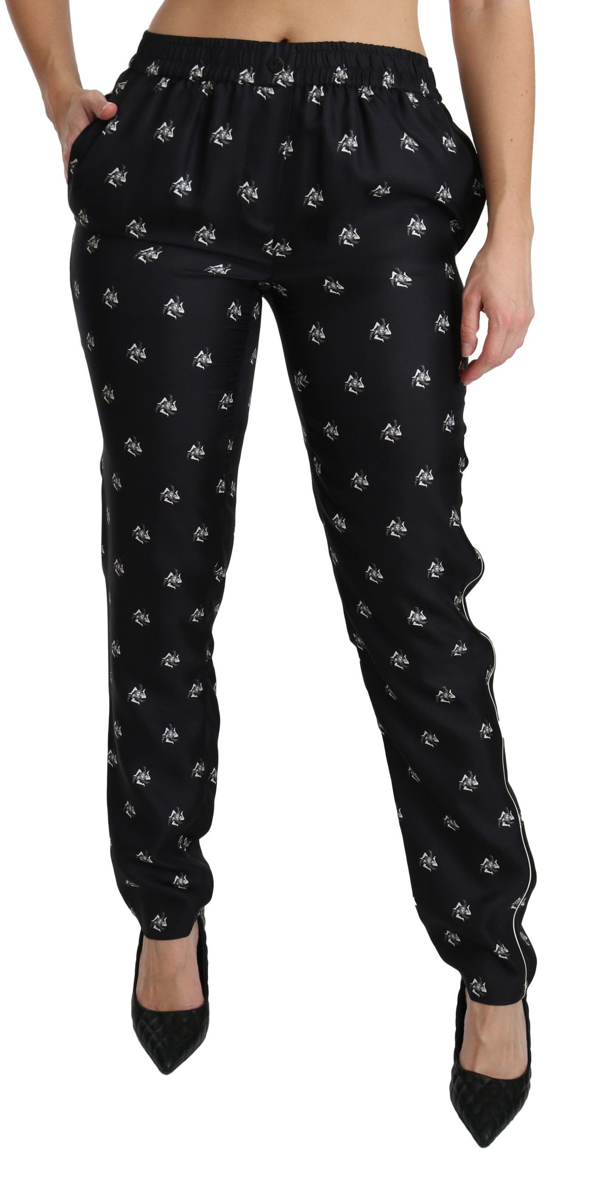 Black printed mid waist skinny silk pants by Dolce & Gabbana, featuring a fitted silhouette and stylish pattern.
