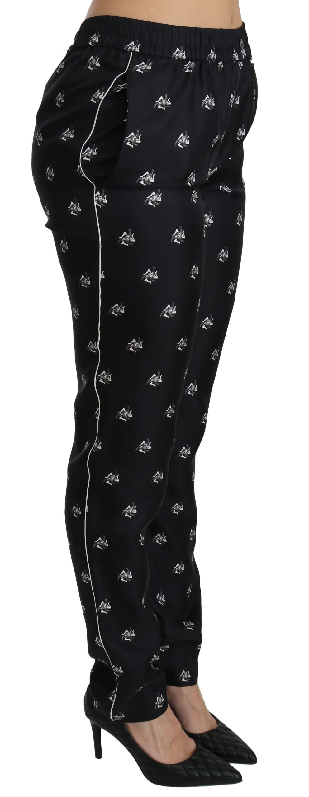 Black printed mid-waist skinny silk pants by Dolce & Gabbana, featuring a sleek fit and stylish pattern.