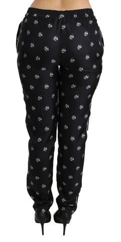 Black printed mid waist skinny silk pants by Dolce & Gabbana featuring a sleek, fitted design and stylish pattern.