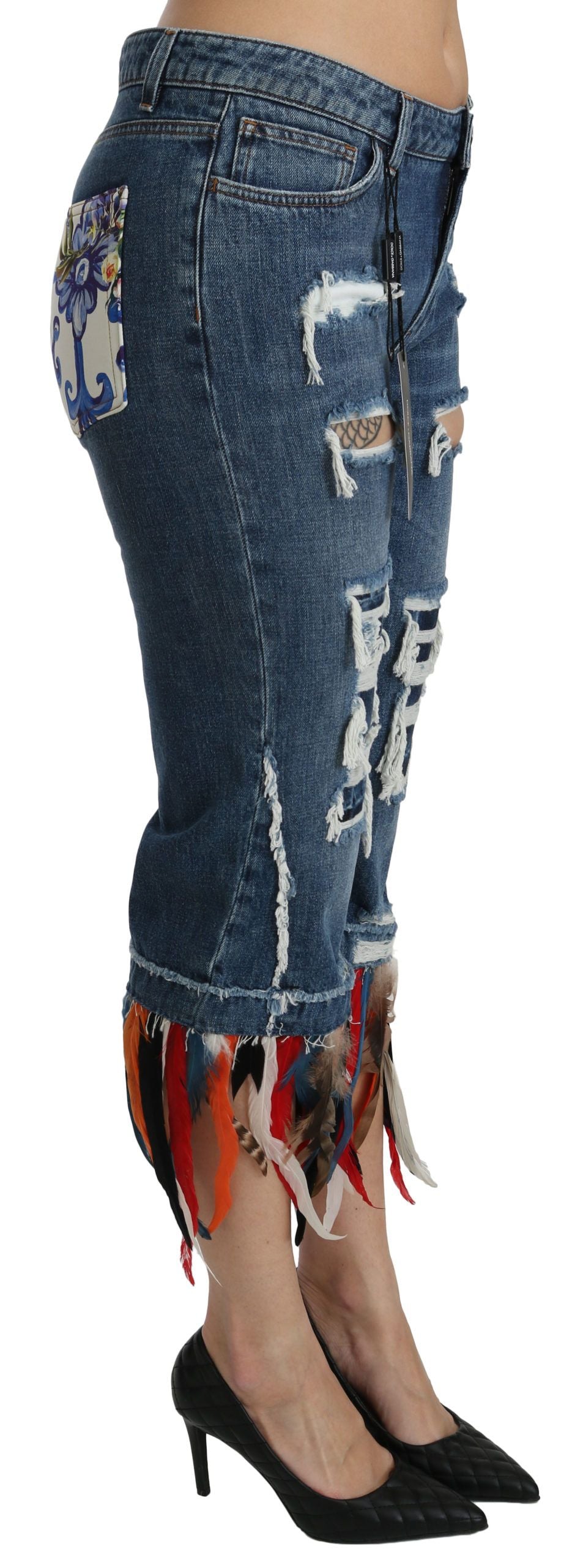 Blue Feathers low waist cropped cotton jeans by Dolce & Gabbana with feather embroidery and distressed details.