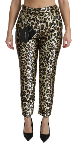 Brown leopard print sequined high waist pants by Dolce & Gabbana, showing the shiny fabric and tailored fit.