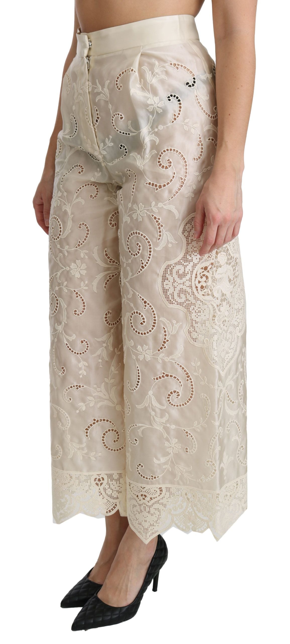 Cream lace high-waist palazzo cropped pants by Dolce & Gabbana, featuring intricate lace details and flowy wide-leg design.