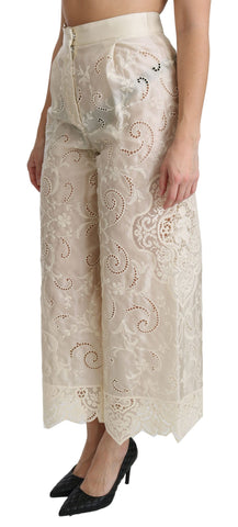 Cream lace high-waist palazzo cropped pants by Dolce & Gabbana, featuring intricate lace details and flowy wide-leg design.