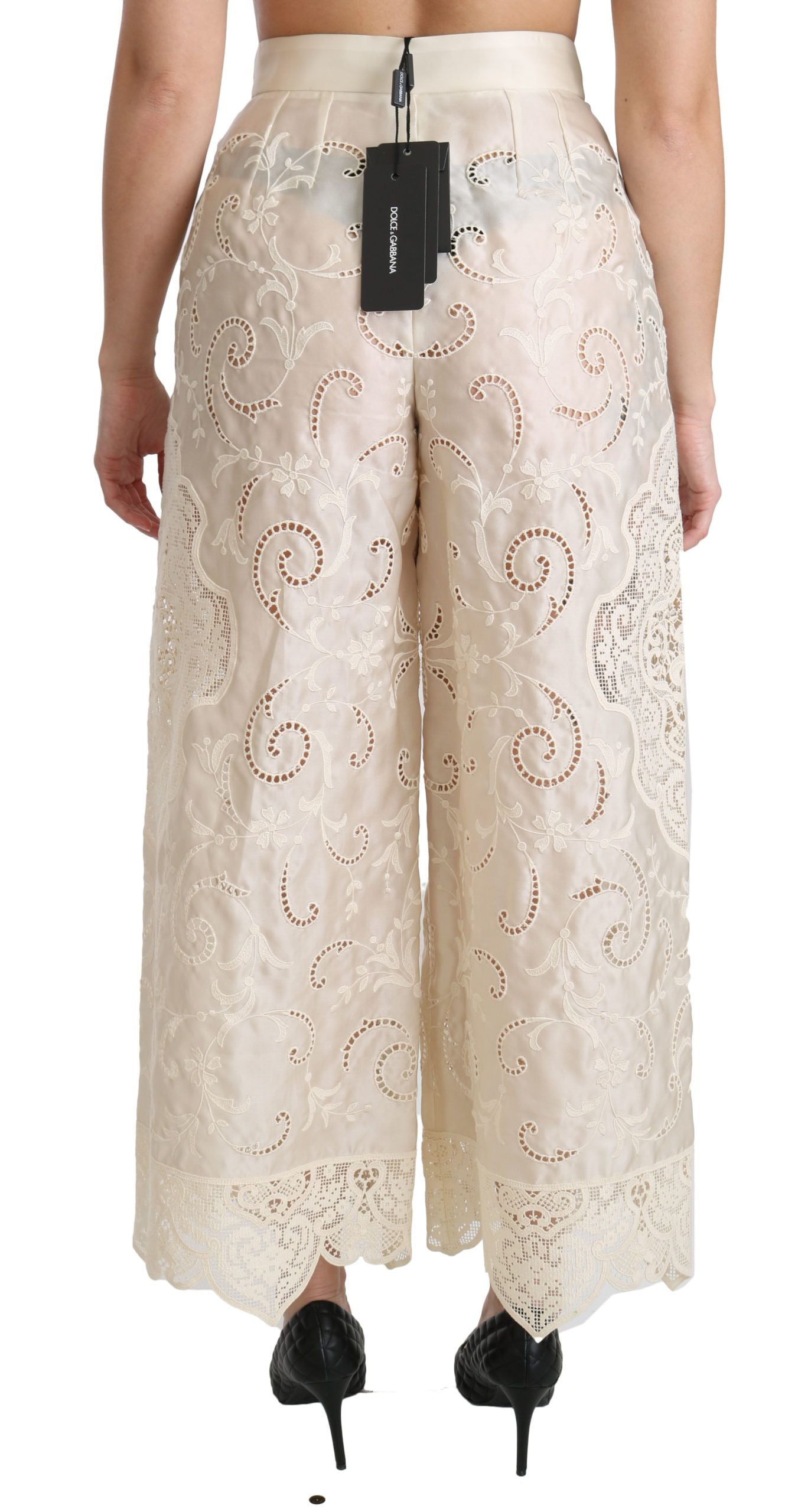 Cream lace high waist palazzo cropped pants by Dolce & Gabbana, featuring intricate lace details and wide-leg style.