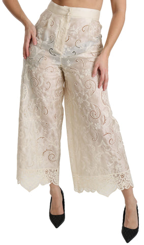 Cream lace high waist palazzo cropped pants by Dolce & Gabbana, featuring intricate lace details and wide-leg style.