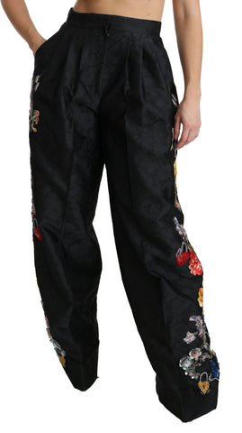 Black brocade floral sequined beaded pants by Dolce & Gabbana with intricate floral embroidery and shimmering bead details.