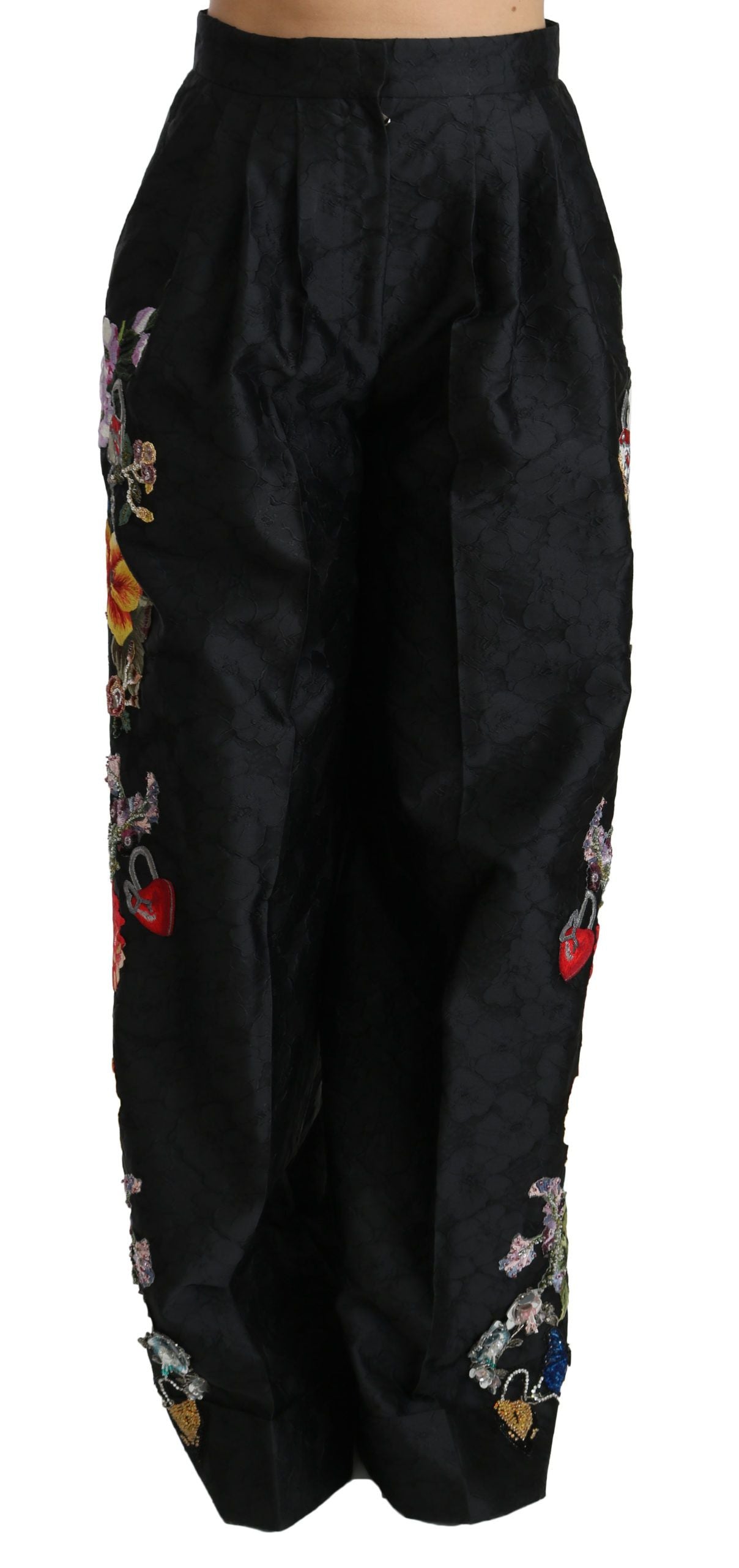 Black brocade floral sequined beaded pants by Dolce & Gabbana, featuring intricate floral patterns and shimmering beadwork.