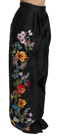 Black brocade floral sequined beaded pants by Dolce & Gabbana, featuring intricate floral embroidery and sparkling bead details.