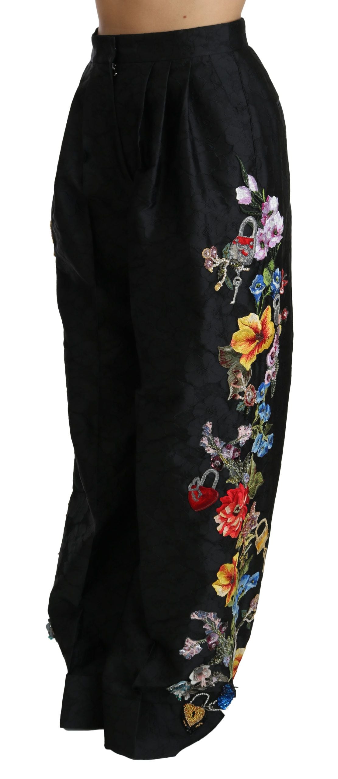 Black brocade floral sequined beaded pants by Dolce & Gabbana featuring intricate embroidery and shimmering embellishments.