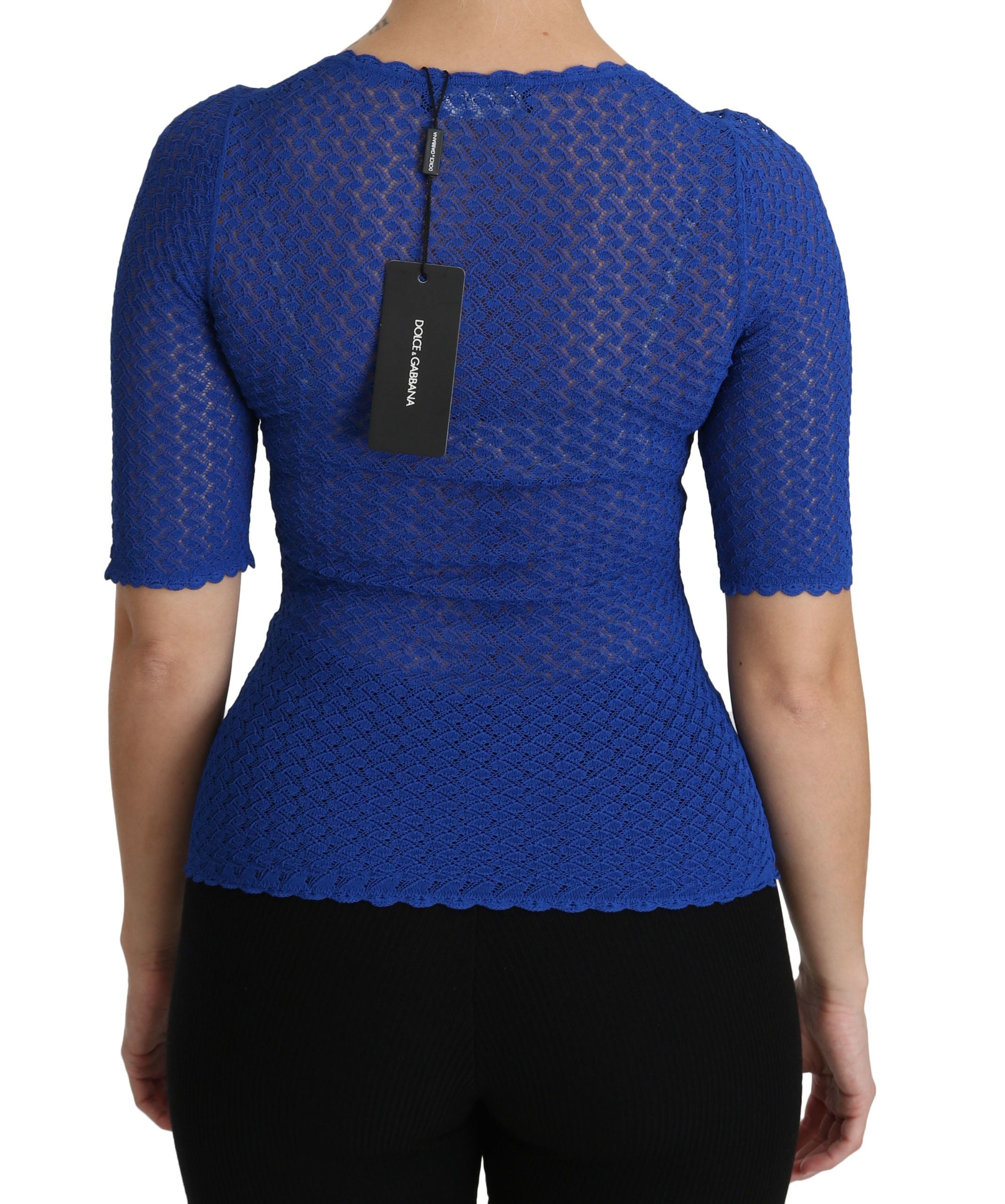 Blue see-through round neck blouse by Dolce & Gabbana, viscose fabric, close-up of the lightweight, sheer top with long sleeves.