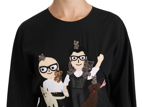 Black Dolce & Gabbana silk blouse featuring the #dgfamily Top T-shirt design, shown on a clean, elegant garment display.