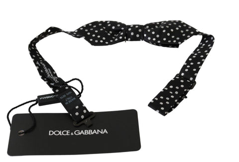 Black polka dots men's silk bow tie with a papillon design, stylish Dolce & Gabbana necktie for formal occasions.