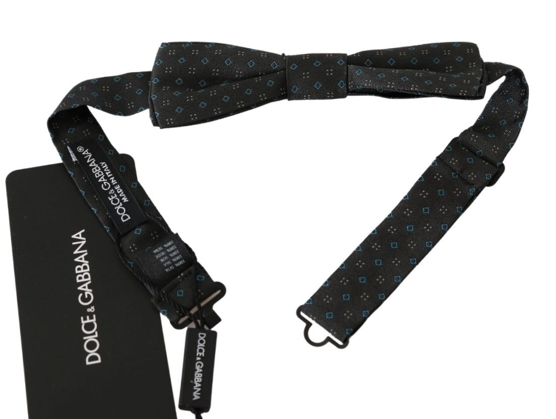 Gray patterned men's silk bow tie with papillon design by Dolce & Gabbana, stylish accessory for formal occasions.