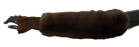 Brown Dolce & Gabbana elbow-length fingerless fur gloves laid flat showing their plush fur texture and stylish design.