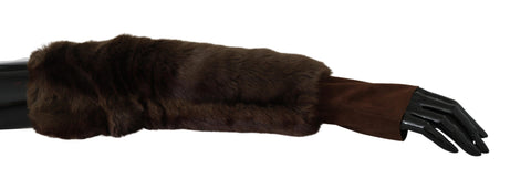 Brown Dolce & Gabbana elbow-length fingerless fur gloves lying flat, showing the soft fur texture and stylish design.