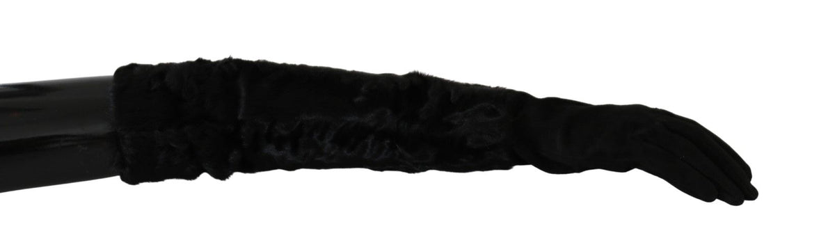 Black suede fur gloves with elbow-length mittens from Dolce & Gabbana, featuring luxurious fur trim and sleek design.