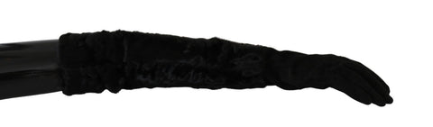 Black suede fur gloves with elbow-length mittens from Dolce & Gabbana, featuring luxurious fur trim and sleek design.