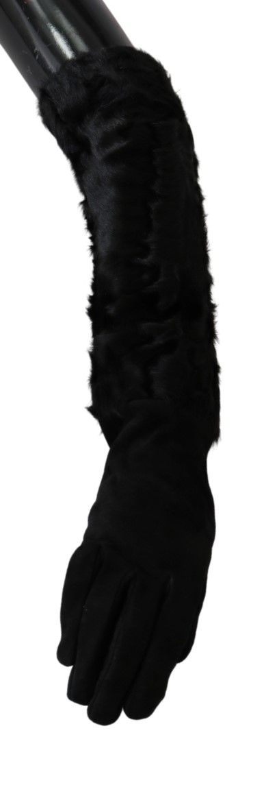 Black suede elbow-length mitten gloves with plush fur trim by Dolce & Gabbana, stylish and cozy winter accessory.