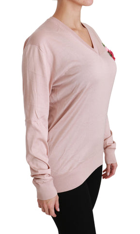 Pink floral embellished silk sweater by Dolce & Gabbana featuring intricate floral embroidery and a cozy pullover design.