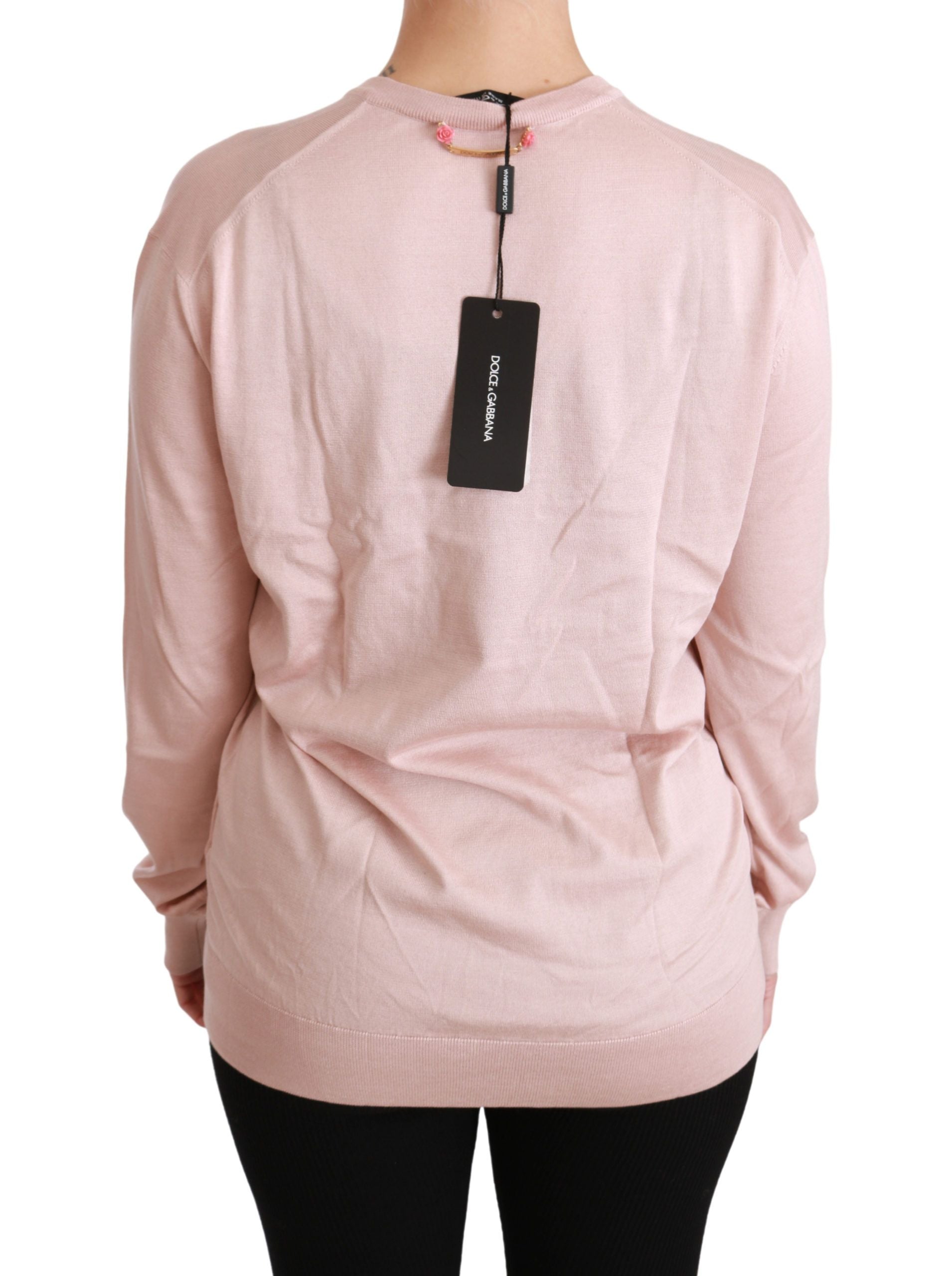 Pink floral embroidered silk pullover sweater by Dolce & Gabbana featuring intricate floral embellishments and a soft, luxurious fabric.