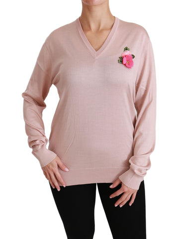 Pink floral embellished silk sweater by Dolce & Gabbana, featuring intricate floral embroidery and a cozy pullover design.