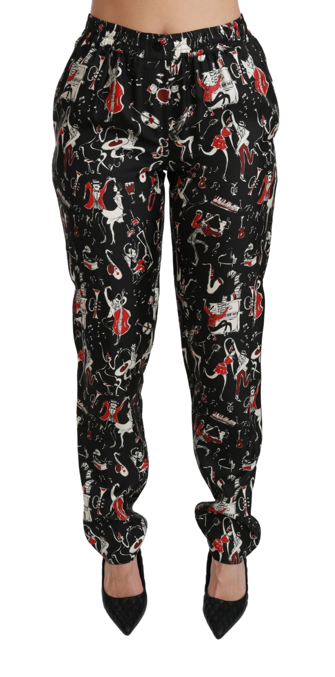Black silk mid waist instrument pants by Dolce & Gabbana, featuring a sleek fit and smooth fabric, shown on a model.