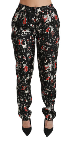 Black silk mid waist instrument pants by Dolce & Gabbana, featuring a sleek fit and smooth fabric, shown on a model.