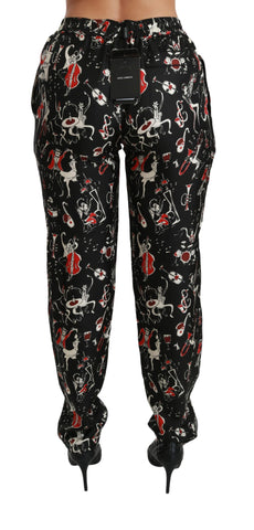Black silk instrument mid-rise pants by Dolce & Gabbana, featuring a sleek, tailored design with a smooth waistband.