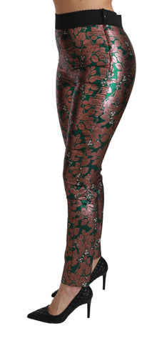 Green bronze leaf-patterned tights with a skinny fit by Dolce & Gabbana, featuring detailed leaf designs and a smooth fabric texture.