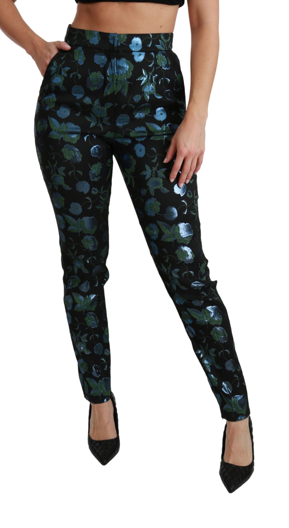 Blue and green floral metallic slim pants by Dolce & Gabbana displayed on a model, showcasing vibrant pattern and sleek fit.