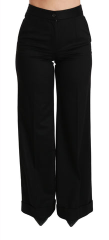 Black wide-leg flared cashmere trousers by Dolce & Gabbana, shown on a model with a relaxed fit and stylish silhouette.