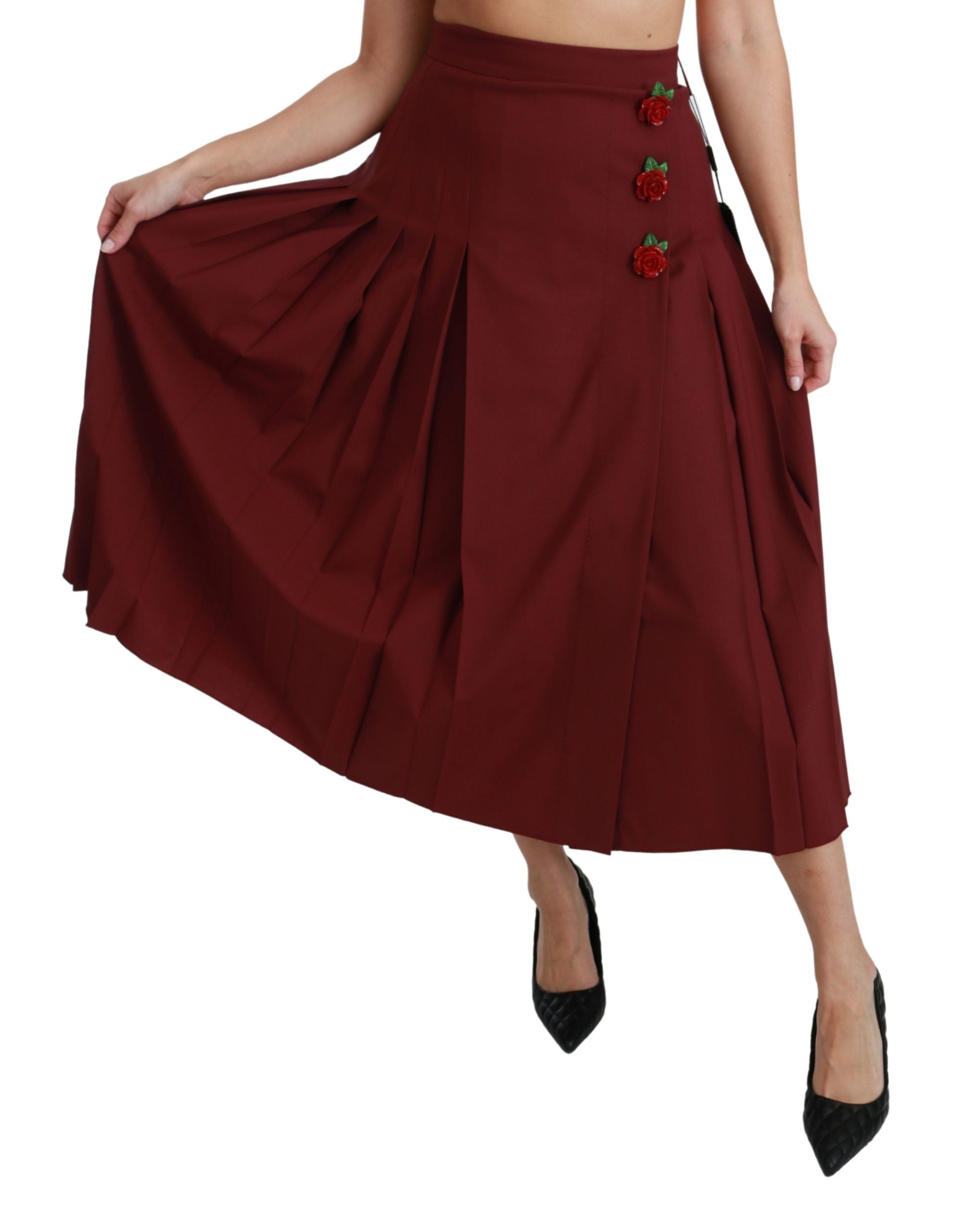 Red high waist pleated maxi wool skirt by Dolce & Gabbana, showing flowing pleats and elegant design.
