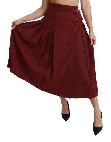 Red high waist pleated maxi wool skirt by Dolce & Gabbana, showing flowing pleats and elegant design.