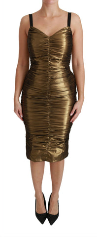 Gold metallic stretch bodycon dress with ruched design by Dolce & Gabbana, form-fitting and stylish for evening wear.