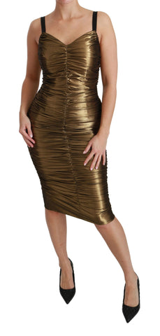 Gold metallic stretch bodycon dress with ruched design by Dolce & Gabbana, form-fitting and stylish, shown on a model.