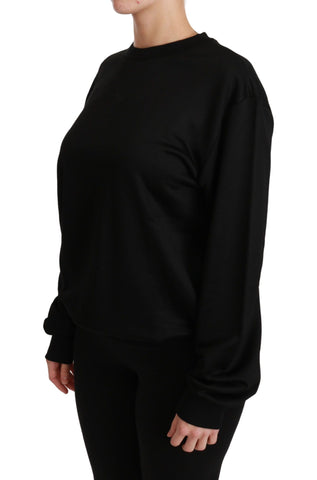 Black cotton crewneck pullover sweater by Dolce & Gabbana, featuring a classic fit and soft fabric on a plain background.