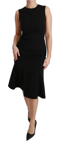 Black fit flare wool stretch sheath dress by Dolce & Gabbana, showcasing tailored silhouette and elegant design.